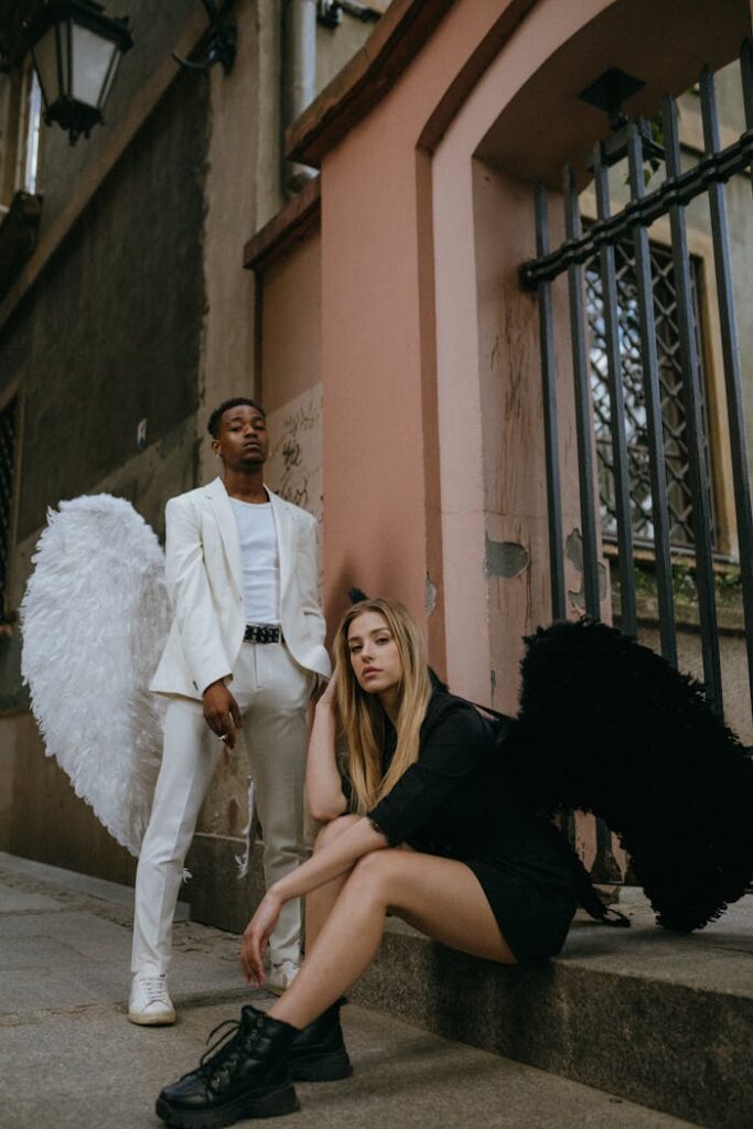 A Man and Woman Wearing Angel Costumes